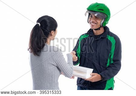 Asian Delivery Courier Delivering Food To Female Customer