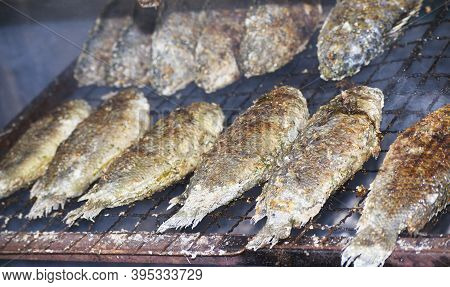 Roast Anabas Is On The Stove, Using Charcoal To Cook.