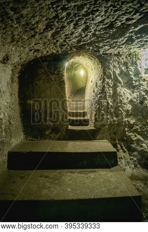 Stairs into cave underground city