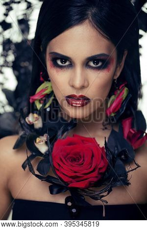 Pretty Brunette Woman With Rose Jewelry, Black And Red, Bright Make Up Kike A Vampire Closeup Red Li