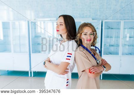 Team Female Doctor Surgeon Working At Surgery Room And Smiling At Camera. School Of Nursing