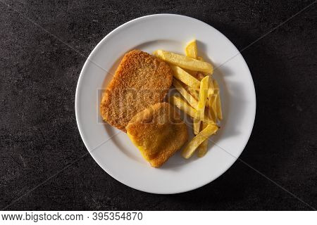 San Jacobo Steak Filled With Cheese And Ham On Black Background.top View