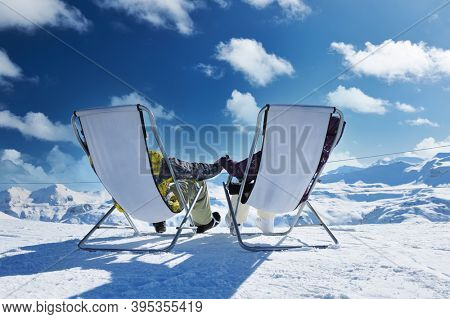 Couple at mountains in winter, Val-d'Isere, Alps, France