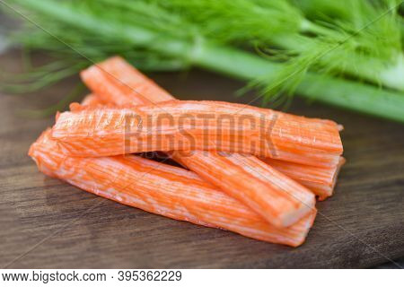 Crab Sticks On Wooden Cutting Board And Vegetable , Fresh Crab Sticks Surimi Ready To Eat Japanese F