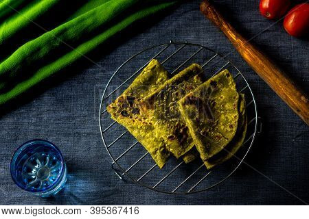 Homemade Delicious Palak Chapathi With Coconut Chutney On A Grey Background