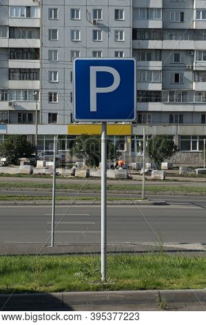 Car Parking Road Sign. A Blue Square Sign On A Post With A White P.