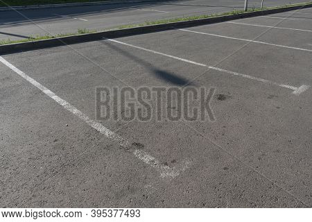 White Markings Of Parking Spaces On Asphalt.
