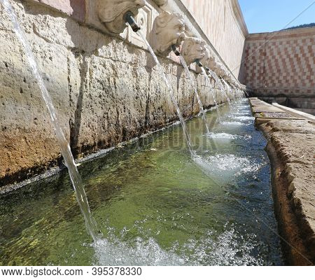 Ancient fountain of the city of L\'Aquila in central Italy called the 99 spouts or 99 CANNELLE in Italian langauge