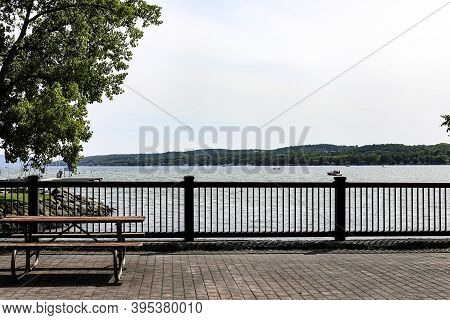 Canandaigua Lake In The Summer. View From The Pedestrian Bridge With A Picnic Area. Canandaigua, New