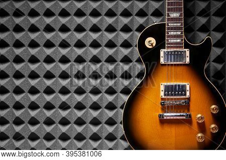Sunburst Electric Guitar On Acoustic Foam Panel