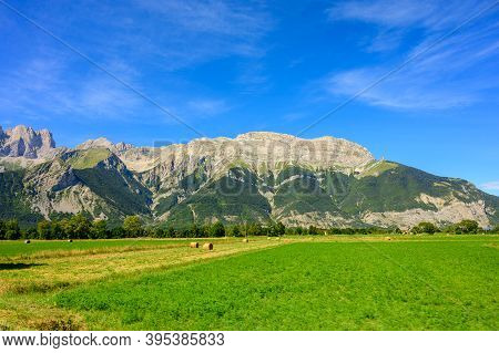 Panoramic View On Breche De Faraut Mountain Range In French Prealps In Summer