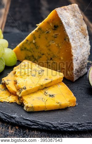 British Matured Yellow Cheese Blue Shropshire, Close Up On Black Stone