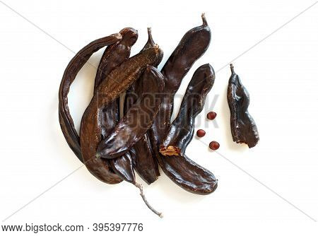 Dry Carob Pods And Seeds Top  View