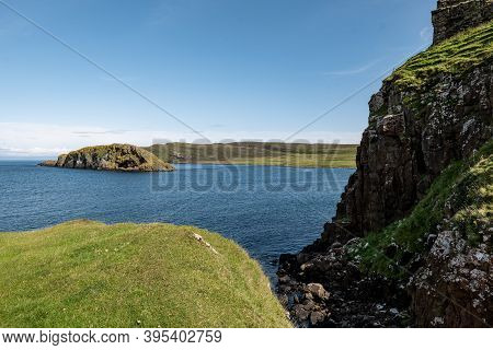 The Landscape With A Rock Where The Duntulm Castle Stands And An Island At Isle Of Skye, Scotland, U