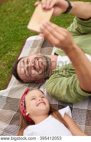 Close Up Of Cheerful Father And His Joyful Little Daughter Smiling While Taking Selfie Pictures, Lyi