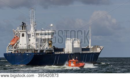 Merchant Vessel  - The Freighter Follows Waterway