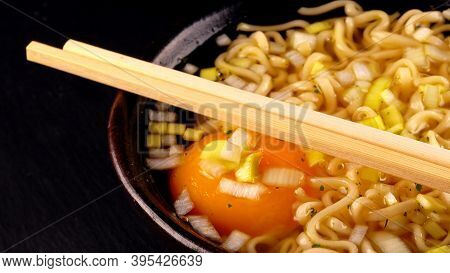 A Noodle Soup With Egg And Leek.