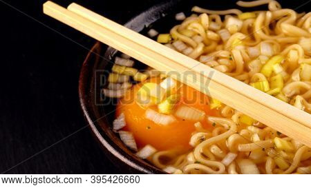 A Noodle Soup With Egg And Leek.