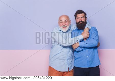 2 Generation. Relationships Concept. Old Dad And Young Son. Old Man And Young Man. Old Dad And Adult