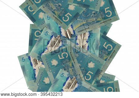 5 Canadian Dollars Bills Flying Down Isolated On White. Many Banknotes Falling With White Copyspace 