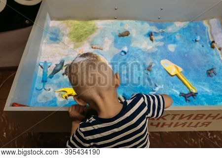 Kids Play With Augmented Reality Sandbox. Interactive Sandbox, Educational And Entertaining World Fo