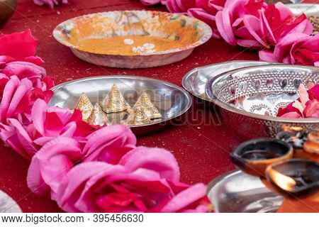 Different Traditional Accessories For Indian Wedding Ceremony On White Background With Flowers.