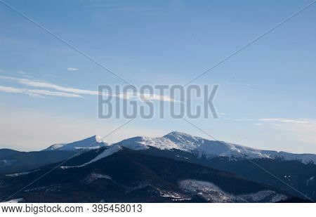 Winter morning. Snowy mountains. Winter