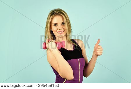 Be Successful. Girl Use Barbell Blue Background. Slim Girl Doing Triceps Exercise With Dumbbell In T