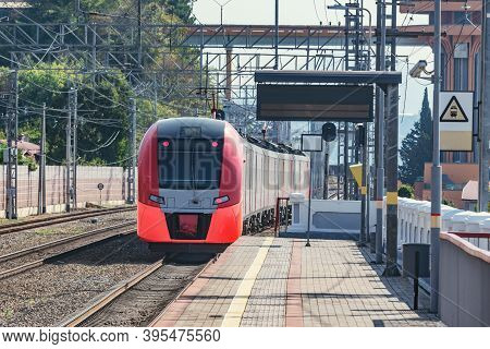 Passenger Train Departs From Dagomys Station. Sochi. Russia.