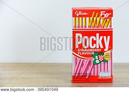 Phuket, Thailand -  November 12, 2020 : Packaging Box Of Glico Brand Pocky Biscuit Sticks Strawberry