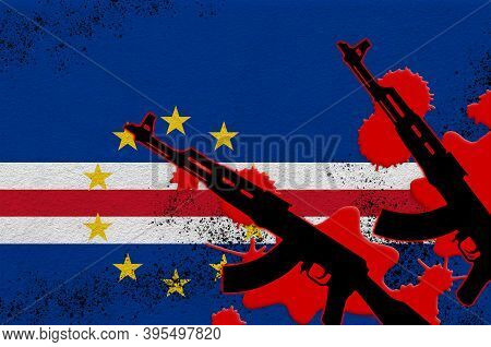 Cabo Verde Flag And Two Black Ak-47 Rifles In Red Blood. Concept For Terror Attack Or Military Opera