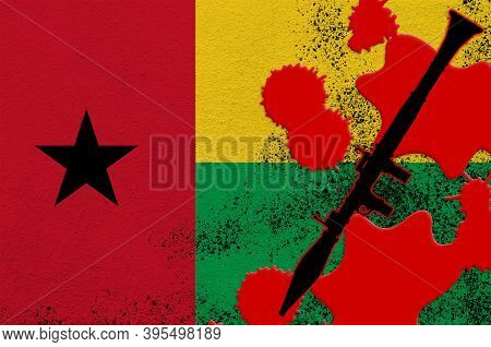Guinea Bissau Flag And Black Rpg-7 Rocket-propelled Grenade Launcher In Red Blood. Concept For Terro