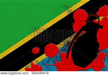 Tanzania Flag And Mk2 Frag Grenade In Red Blood. Concept For Terror Attack Or Military Operations Wi