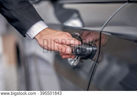 Close-up Of Male Hand Opening Car Door