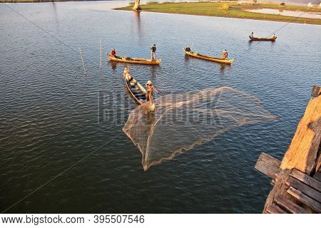 Mandalay, Myanmar - Nov 12, 2019: Fishermen Near U Bein Bridge In Amarapura,mandalay Myanmar