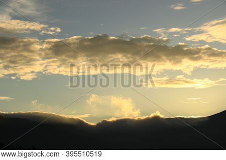 Cloudy Sky Over Mount Sindoro. Black Clouds With Morning Sunlight
