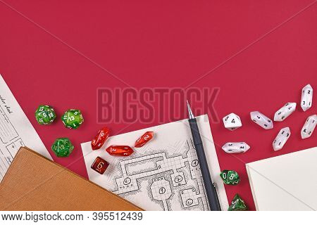 Tabletop Role Playing Flat Lay With Rpg Game Dices, Hand Drawn Dungeon Map, Rule Books And Pen At Bo
