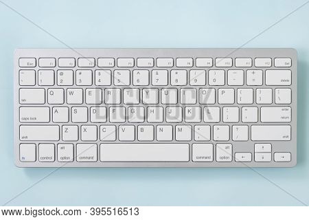 Close Up White Portable Computer Keyboard Keys Or Keyboard Button On Blue Pastel Minimalist Backgrou