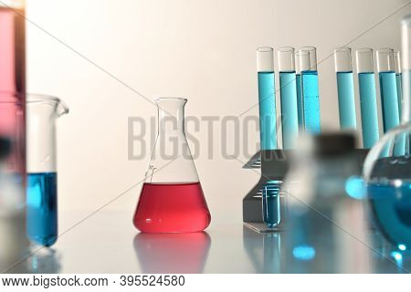 Glassware On Laboratory Bench With Flask Detail. Front View. Horizontal Composition.