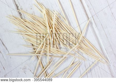 Bamboo Toothsticks On The White Table. Great Photo For Your Needs.