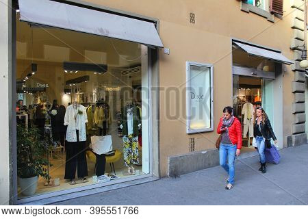 Florence, Italy - April 30, 2015: People Walk By Dixie Fashion Store In Florence. Dixie Apparel Bran