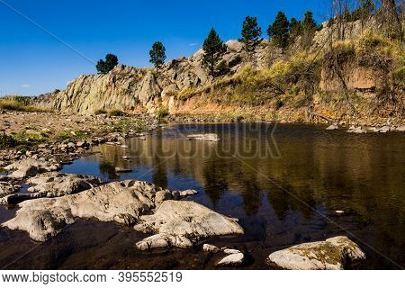 Beautiful Rocks At The Bottom Of The River With Little Water. Mountain Landscape. Mountain River