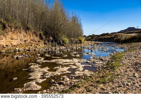Beautiful Rocks At The Bottom Of The River With Little Water. Mountain Landscape. Mountain River