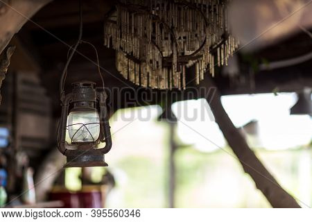 Old Rusty Indian Style Lantern. Vintage Old Lanterns Hanging. Old Style Burning Lantern Hanging Form