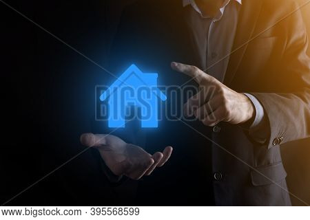 Real Estate Concept, Businessman Holding A House Icon.house On Hand.property Insurance And Security