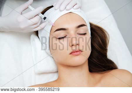 Woman Getting Cosmetic. Injection. Beauty Injections And Cosmetology.  Young Woman In Beauty Salon S