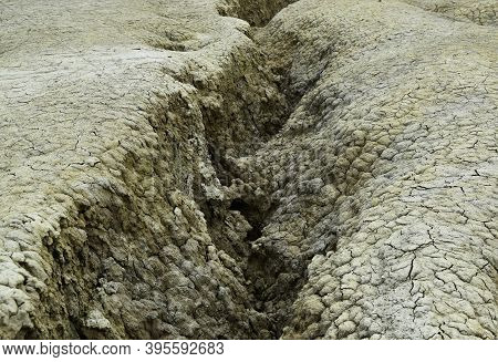 Undulated Water Canal In Dry Soil Texture. The Mud Volcanoes Is A Geological And Botanical Reservati