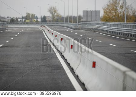 Shallow Depth Of Field (selective Focus) Image With Concrete Jersey Barriers (jersey Walls Or Jersey