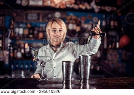 Girl Barman Formulates A Cocktail In The Porterhouse