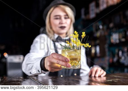Girl Bartender Concocts A Cocktail In The Saloon